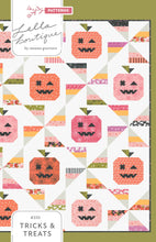 Load image into Gallery viewer, "Tricks & Treats" candy quilt featuring pumpkins and candy corn pinwheels. Fabric is Hey Boo by Lella Boutique for Moda Fabrics (April 2024).