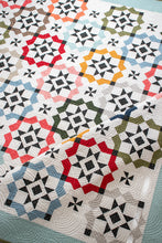 Load image into Gallery viewer, Glam Squad overlapping star tile quilt by Vanessa Goertzen of Lella Boutique. Fabric is Magic Dot by Lella Boutique for Moda Fabrics (October 2024). Make it with a dessert roll or fat eighths! Download the PDF pattern here.