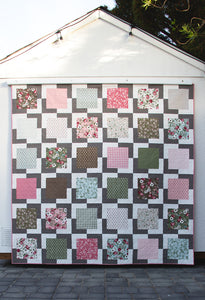 "Iconic" layer cake quilt by Lella Boutique. Simple, modern beginner quilt that is quick to make. Fabric is Lovestruck by Lella Boutique for Moda Fabrics.