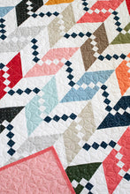 Load image into Gallery viewer, "Persnickety" herringbone quilt design in Magic Dot fabric by Lella Boutique for Moda Fabrics (October 2024).Download the PDF pattern here!