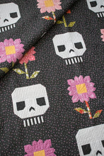 Load image into Gallery viewer, &quot;Pushing Up Daisies&quot; skull quilt by Lella Boutique. Cute mix of daisies and skeletons in this Halloween quilt. Fabric is Hey Boo by Lella Boutique for Moda Fabrics (April 2024).