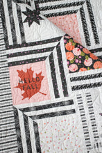 Load image into Gallery viewer, "The Web" modern Halloween quilt in Hey Boo fabric by Lella Boutique for Moda Fabrics. Modern spider web quilt using a Layer Cake and/or the Hey Boo quilt panel.