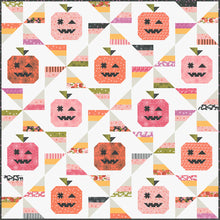 Load image into Gallery viewer, "Tricks & Treats" candy quilt featuring pumpkins and candy corn pinwheels. Fabric is Hey Boo by Lella Boutique for Moda Fabrics (April 2024).