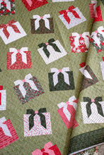 Load image into Gallery viewer, "Wrap It Up" gift quilt design by Vanessa Goertzen of Lella Boutique. Pretty wonky presents in a simple layout. Fat quarter friendly. Fabric is Berry & Pine by Lella Boutique for Moda Fabrics (May 2025). Download the PDF here.