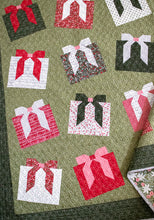 Load image into Gallery viewer, "Wrap It Up" gift quilt design by Vanessa Goertzen of Lella Boutique. Pretty wonky presents in a simple layout. Fat quarter friendly. Fabric is Berry & Pine by Lella Boutique for Moda Fabrics (May 2025). Download the PDF here.