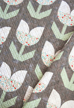 Load image into Gallery viewer, "Holland" tulip quilt by Lella Boutique. Beginner curved piecing technique to make simple tulip blocks. Fabric is Garden Variety by Lella Boutique for Moda. Download the PDF here!