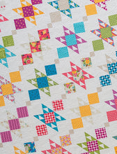Load image into Gallery viewer, Charm Bracelet quilt from the book: Charm School - 18 Quilts from 5" Squares by Vanessa Goertzen of Lella Boutique. Get your autographed copy of the book here! Lots of great charm pack quilts. Fabric is Meadowbloom by April Rosenthal of Prairie Grass Patterns for Moda Fabrics.