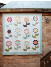 Load image into Gallery viewer, Cottage Blossoms flower quilt by Vanessa Goertzen of Lella Boutique. Make it with a layer cake or fat quarters. Fabric is Little Miss Sunshine by Lella Boutique for Moda Fabrics.