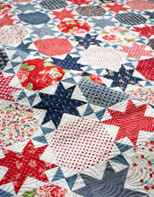 Load image into Gallery viewer, Starstruck 2 bursting star quilt featuring sawtooth star blocks. Layer Cake quilt or fat quarter quilt. Fabric is Early Bird by Bonnie & Camille for Moda. Great 4th of July quilt. Download the PDF here!