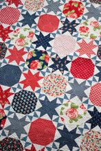 Load image into Gallery viewer, Starstruck 2 bursting star quilt featuring sawtooth star blocks. Layer Cake quilt or fat quarter quilt. Fabric is Early Bird by Bonnie & Camille for Moda. Great 4th of July quilt. Download the PDF here!