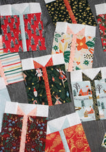 Load image into Gallery viewer, Gift Swap charm pack quilt by Lella Boutique. Cute Christmas present quilt in Holiday Classics fabric by Rifle Paper Co. for Cotton + Steel. Make it with charm packs, fat quarters, or scraps.