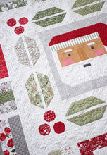Load image into Gallery viewer, Jolly Holiday Christmas quilt by Vanessa Goertzen of Lella Boutique. Christmas medallion quilt design featuring traditionally piece Santa, holly berries and leaves, and scrappy gifts. Jelly Roll friendly! Fabric is Christmas Eve by Lella Boutique for Moda Fabrics arriving May 2023.