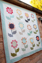 Load image into Gallery viewer, Cottage Blossoms flower quilt by Vanessa Goertzen of Lella Boutique. Make it with a layer cake or fat quarters. Fabric is Little Miss Sunshine by Lella Boutique for Moda Fabrics.