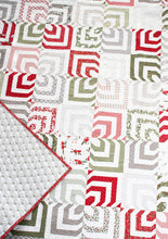 Load image into Gallery viewer, Kaleidoscope 2 hypnotic quilt design. Honeybun quilt (made with 1.5" strips). Fabric is Christmas Morning by Lella Bourique for Moda.