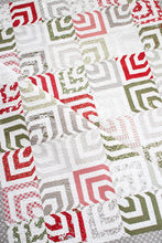 Load image into Gallery viewer, Kaleidoscope 2 hypnotic quilt design. Honeybun quilt (made with 1.5&quot; strips). Fabric is Christmas Morning by Lella Bourique for Moda. Download the PDF here.