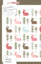 Load image into Gallery viewer, Wild Hare bunny quilt pattern by Vanessa Goertzen of Lella Boutique. Cute pieced rabbit quilt block in a forest of trees. Fat quarter friendly! Fabric is Lovestruck by Lella Boutique for Moda Fabrics. Download the PDF here.
