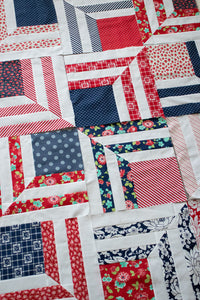"Fracture" modern log cabin quilt. Fat eighth quilt. Great 4th of July quilt. Fabric is  red and navy prints by Bonnie & Camille for Moda.