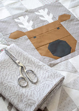 Load image into Gallery viewer, Reindeer Xing pieced reindeer quilt by Vanessa Goertzen of Lella Boutique. Fabric is Christmas Eve by Lella Boutique for Moda Fabrics. Make it with fat quarters or scrappy with a Layer Cake.