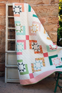 Star Crossed sawtooth star quilt by Vanessa Goertzen of Lella Boutique. Jelly Roll or Layer Cake friendly. Fabric is Sugar Pie by Lella Boutique for Moda Fabrics.