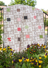 Load image into Gallery viewer, Candy Box - one charm pack quilt. Cool geometric design to showcase one charm pack in a quilt. Fabric is Olive's Flower Market by Lella Boutique for Moda Fabrics.