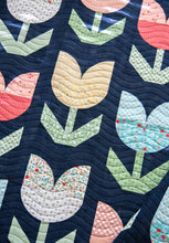 Load image into Gallery viewer, "Holland" tulip quilt by Lella Boutique. Beginner curved piecing technique to make simple tulip blocks. Fabric is Garden Variety by Lella Boutique for Moda. Download the PDF here!