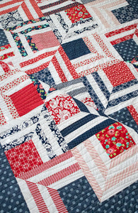"Fracture" modern log cabin quilt. Fat eighth quilt. Great 4th of July quilt. Fabric is red and navy prints by Bonnie & Camille for Moda. Download the PDF here!