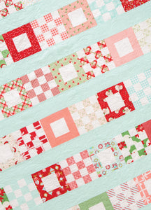 Petit Fours scrap quilt from the book: Jelly Filled - 18 Quilts from 2-1/2" Strips by Vanessa Goertzen of Lella Boutique. Get your autographed copy of the book here! Lots of great jelly roll strip quilts. Fabric is Swell Christmas by Urban Chiks + Vintage Holiday by Bonnie & Camille for Moda Fabrics.