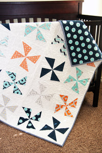 Shuffle pinwheel quilt pattern by Lella Boutique. Make it with charm packs or fat quarters. Fabric is Mixologie by Studio M for Moda Fabrics.