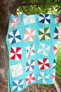 Shuffle pinwheel quilt pattern by Lella Boutique. Make it with charm packs. Fabric is Love Note by Gooseberry by Lella Boutique for Moda Fabrics