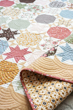 Load image into Gallery viewer, Starstruck 2 beautiful bursting star quilt featuring sawtooth stars. Fat quarter quilt or layer cake quilt. Fabric is Folktale by Lella Boutique for Moda Fabrics.