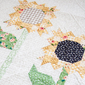 Scrappy Sunflowers quilt by Lella Boutique. Fabric is Farmer's Daughter by Lella Boutique for Moda Fabrics.