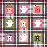 "Ghost Town" quilt by Lella Boutique featuring cute haunted house quilt blocks and friendly ghosts. Fabric is Hey Boo by Lella Boutique for Moda Fabrics (April 2024).