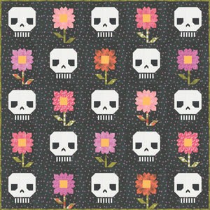 "Pushing Up Daisies" skull quilt by Lella Boutique. Cute mix of daisies and skeletons in this Halloween quilt. Fabric is Hey Boo by Lella Boutique for Moda Fabrics (April 2024). Download the PDF here!