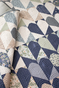 "Achy Breaky" heart quilt in True Love fabric by Lella Boutique for Moda Fabrics. Fat quarter friendly and bringing all the drama with these scrappy heart blocks. Download the PDF here