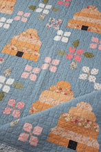 Load image into Gallery viewer, Bloom &amp; Buzz beehive and flower quilt by Lella Boutique. Jelly Roll friendly Fabric is Wild Honey by Lella Boutique for Moda Fabrics (Nov 2025).