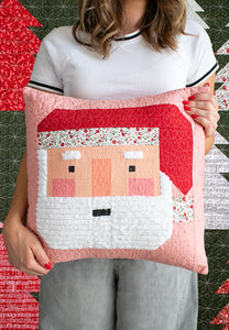 "Sew Jolly" patchwork Santa pillow made in Berry & Pine fabric by Lella Boutique for Moda Fabrics. Give him a fluffy beard by embellishing with Chenille-It Blooming Bias. Download the PDF here!