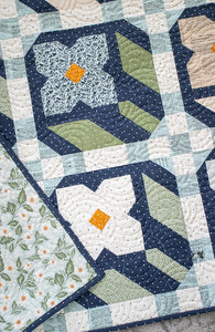 "Flower Press" geometric flower quilt by Lella Boutique. Layer Cake friendly - fabric is True Love by Lella Boutique for Moda Fabrics. Download the PDF here.