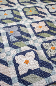 "Flower Press" geometric flower quilt by Lella Boutique. Layer Cake friendly - fabric is True Love by Lella Boutique for Moda Fabrics. Download the PDF here.