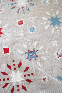 "Grand Finale" fireworks quilt by Lella Boutique. Cute 4th of July quilt reminiscent of a night filled with sparklers and exploding fireworks. Fabric is Old Glory by Lella Boutique for Moda Fabrics.
