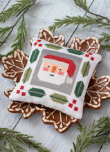 Load image into Gallery viewer, Jolly Stitches Christmas cross stitch by Vanessa Goertzen of Lella Boutique. Cute Santa and reindeer cross stitch patterns. Finish as pin cushions, framed ornaments, or incorporate into zipper or drawstring bags! Download the PDF here