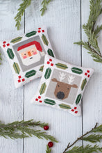 Load image into Gallery viewer, Jolly Stitches Christmas cross stitch by Vanessa Goertzen of Lella Boutique. Cute Santa and reindeer cross stitch patterns. Finish as pin cushions, framed ornaments, or incorporate into zipper or drawstring bags! Download the PDF here