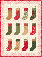 Load image into Gallery viewer, "By the Chimney Mini" Christmas stocking wall hanging quilt pattern in Peppermint Cocoa by Lella Boutique for Moda Fabrics. Perfect for scraps! Download the PDF here!
