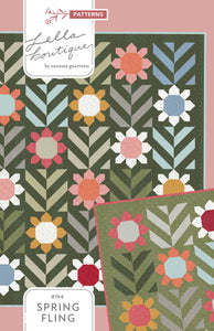 "Spring Fling" geometric flower quilt by Lella Boutique. Fat quarter quilt. Fabric is Magic Dot by Lella Boutique for Moda Fabrics. Download the PDF here!