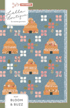 Load image into Gallery viewer, Bloom and Buzz beehive and flower quilt by Lella Boutique. Cutest little scrappy beehives and patchwork made from Jelly Roll strips. Fabric is Wild Honey by Lella Boutique for Moda Fabrics (Nov 2025). Download the PDF here.