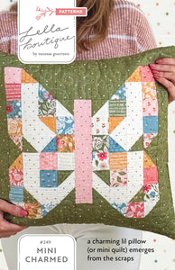 Mini Charmed scrappy butterfly block in Wild Honey fabric by Lella Boutique for Moda Fabrics. This butterfly block is made with a mini charm pack (or scraps) and can be finished as a pillow or mini quilt. Download the PDF here.