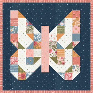Mini Charmed butterfly mini quilt. Make this scrappy butterfly block with a mini charm pack. Fabric is Wild Honey by Lella Boutique for Moda Fabrics (Nov 2025).