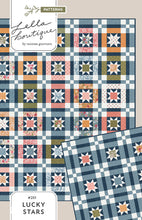 Load image into Gallery viewer, &quot;Lucky Stars&quot; quilt in Wild Honey fabric by Lella Boutique for Moda Fabrics. Make a scrappy colorful version with a Layer Cake - or keep it classic with a dreamy blue version (and a charm pack). Download the PDF here!