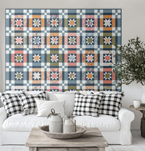 Load image into Gallery viewer, "Lucky Stars" quilt in Wild Honey fabric by Lella Boutique for Moda Fabrics. Make a scrappy colorful version with a Layer Cake - or keep it classic with a dreamy blue version (and a charm pack). Download the PDF here!