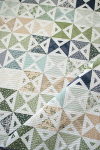 "Meet Cute" simple geometric triangle quilt In True Love fabric by Lella Boutique for Moda Fabrics. Make it with fat quarters, fat eighths, or scraps. Download the PDF here!