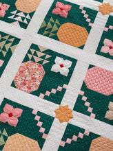 Load image into Gallery viewer, "Piña Colada" pineapple quilt by Vanessa Goertzen of Lella Boutique. Fat eighth friendly featuring pineapples, flower, and bold tropical vibes! Fabric is Garden Glam by Lella Boutique for Moda Fabrics (Nov 2026). Download the PDF here!